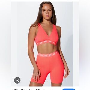 Yitty hot pink biker shorts (M) and sports bra (S)
